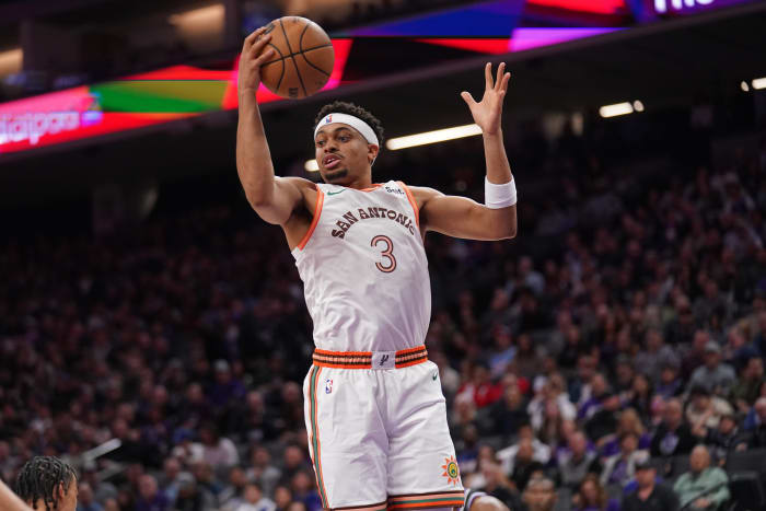 San Antonio Spurs forward Keldon Johnson (3) holds onto a rebound against the Sacramento Kings in the second quarter at the Golden 1 Center.